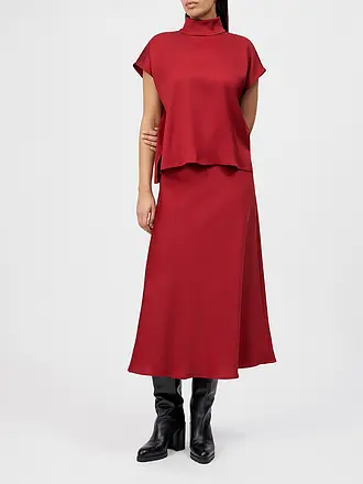 DRYKORN | Nombre del producto: Blusa ALARIA 1
Marca: DRYKORN
Color: rojo
Categorías: Moda,Mujer

Largo de manga: Manga corta
Material: Fibra sintética,Elástico
Forma del cuello: Cuello alto
Diseño: Liso
Corte (Prenda superior): Suelto
Estilo: Puro,Tendencia
Det | 